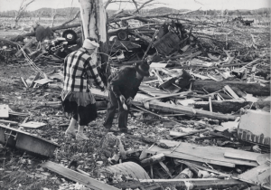 Colfax residents picking through the wreckage. In the background is a vehicle that was thrown. Credit: University of Wisconsin