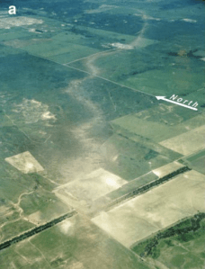 Severe ground scouring and a cycloidal damage path are indicative of a powerful tornado. Credit: VORTEX