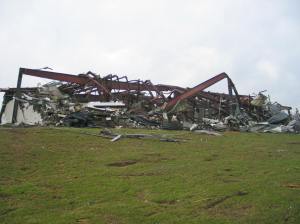 This warehouse was completely leveled and steel beams were twisted or snapped off at the base. Credit: NOAA