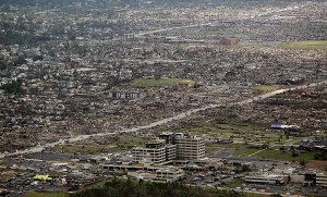 An aerial view of the devastation around St. John's Regional Medical Center. The hospital was so badly damaged it had to be condemned. Credit: Charlie Riedel/AP